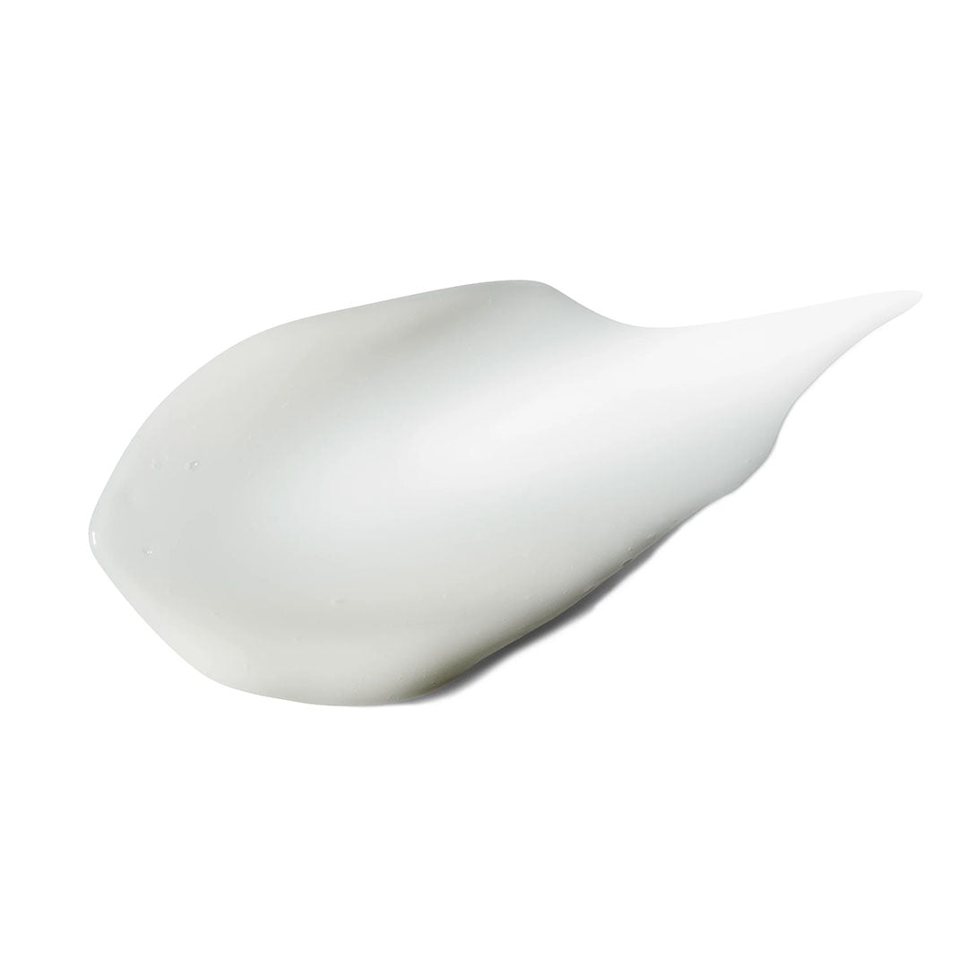 A creamy white swatch of Eye Renew Complex serum, showing its smooth, rich texture.