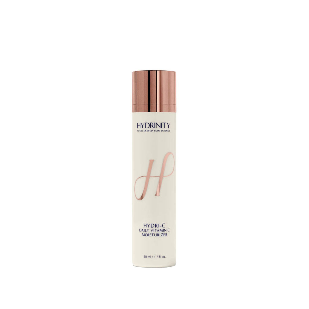 White HYDRINITY HYDRI-C Daily Vitamin C Moisturizer bottle with rose gold pump and "H" logo.