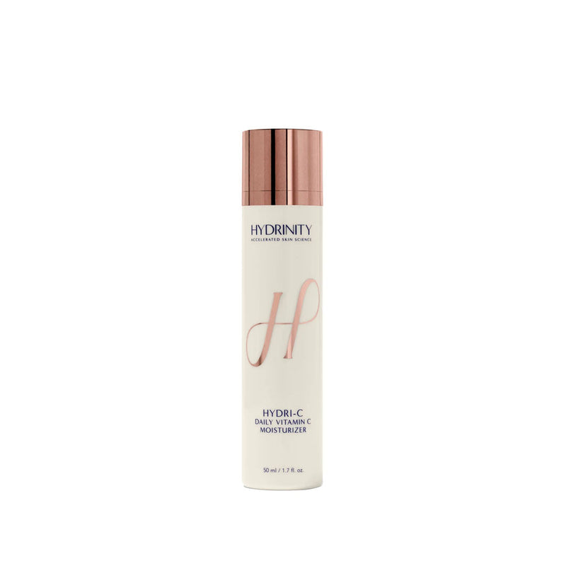 White HYDRINITY HYDRI-C Daily Vitamin C Moisturizer bottle with rose gold pump and "H" logo.