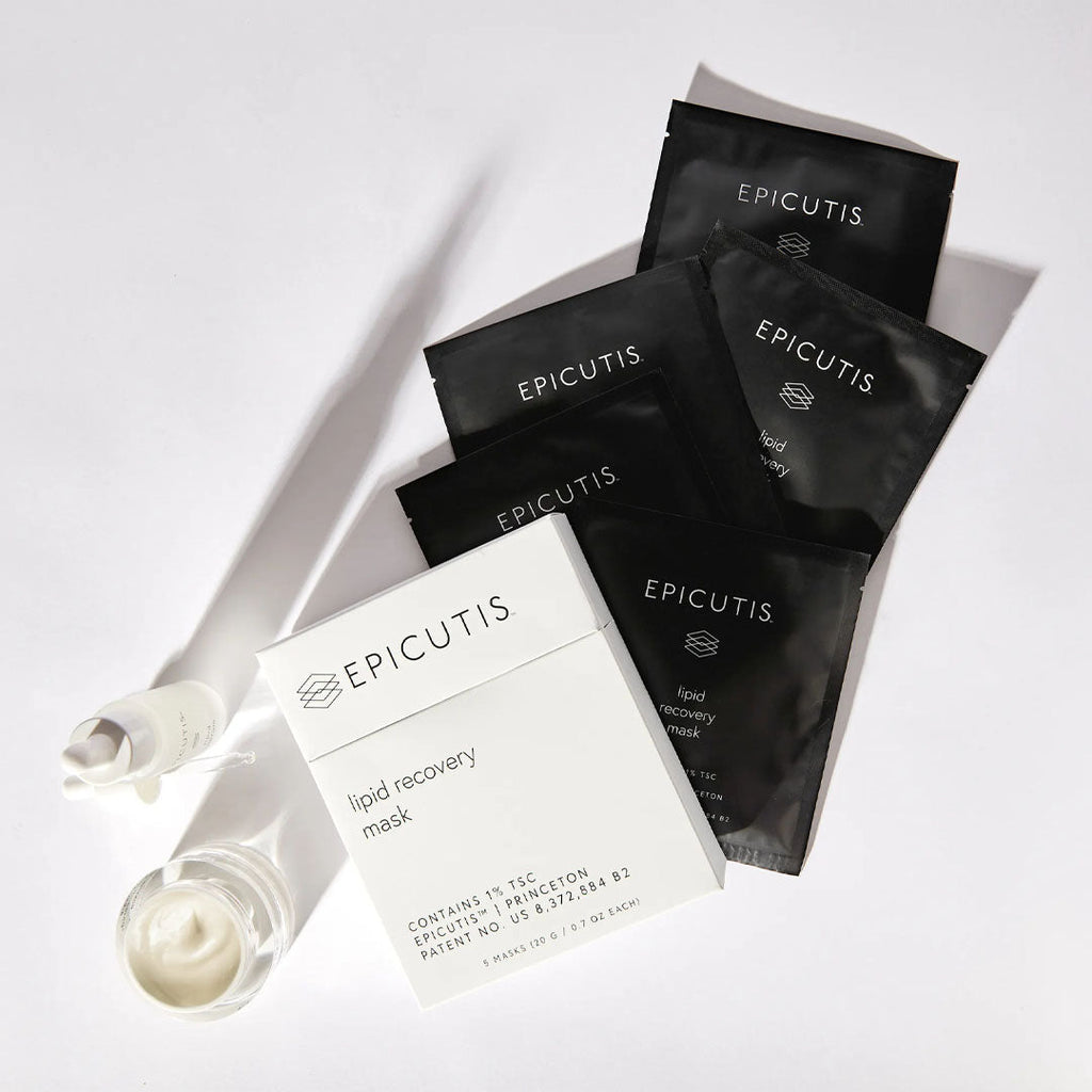 White box of Epicutis Lipid Recovery Masks with black individual packets, a white serum bottle, and a cream jar.
