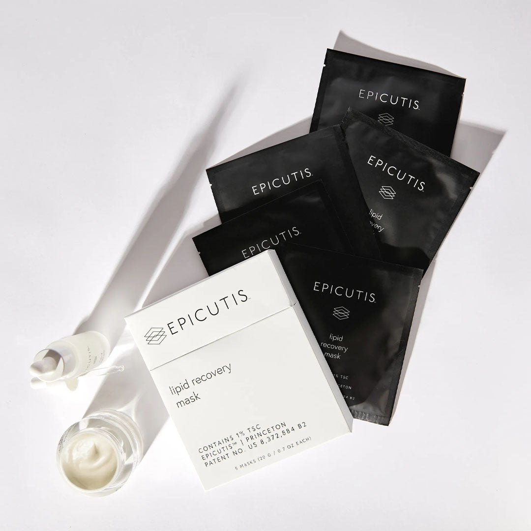 White box of Epicutis Lipid Recovery Masks with black individual packets, a white serum bottle, and a cream jar.