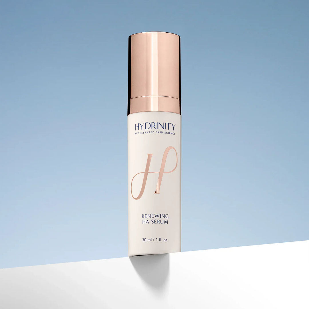 White Hydrinity Renewing HA Serum bottle with rose gold pump and cap, 30ml size.