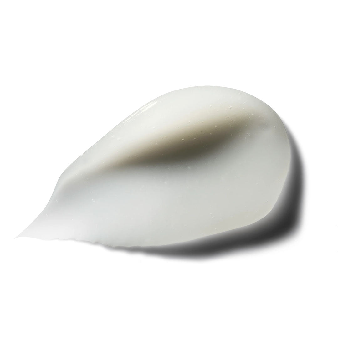 White, pearlescent cream swatch with a smooth, thick texture, casting a soft shadow.