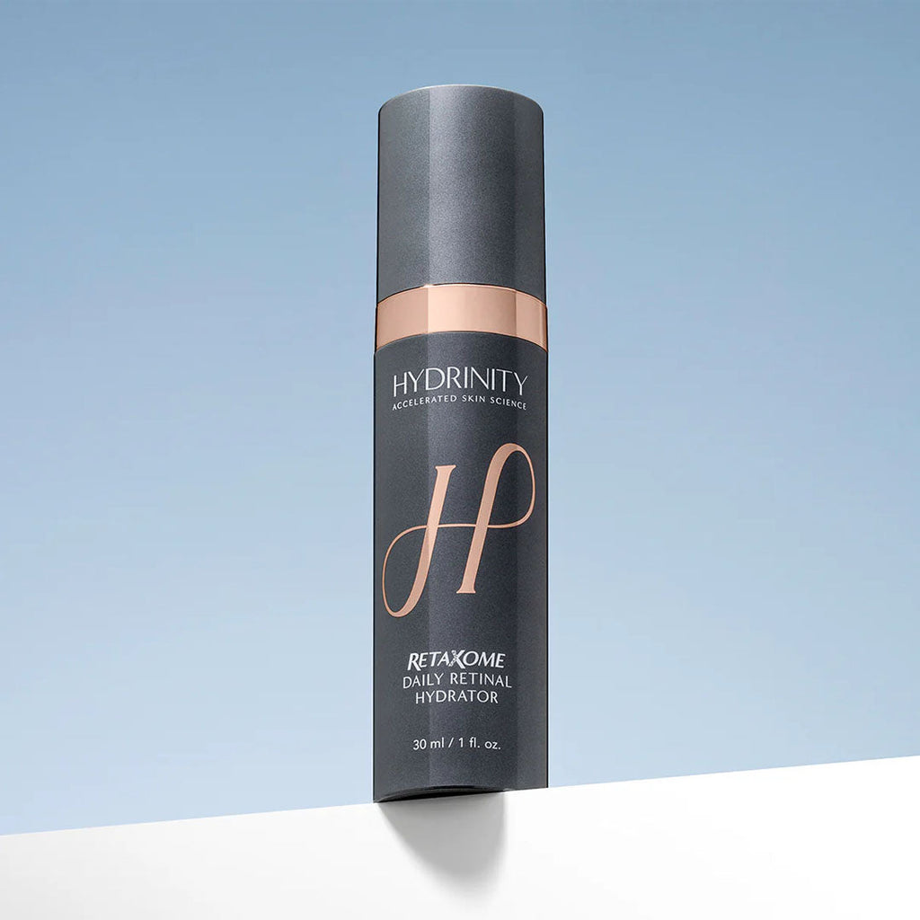Hydrinity Retaxome Daily Retinal Hydrator, a sleek dark gray 30ml pump bottle with rose gold accents.