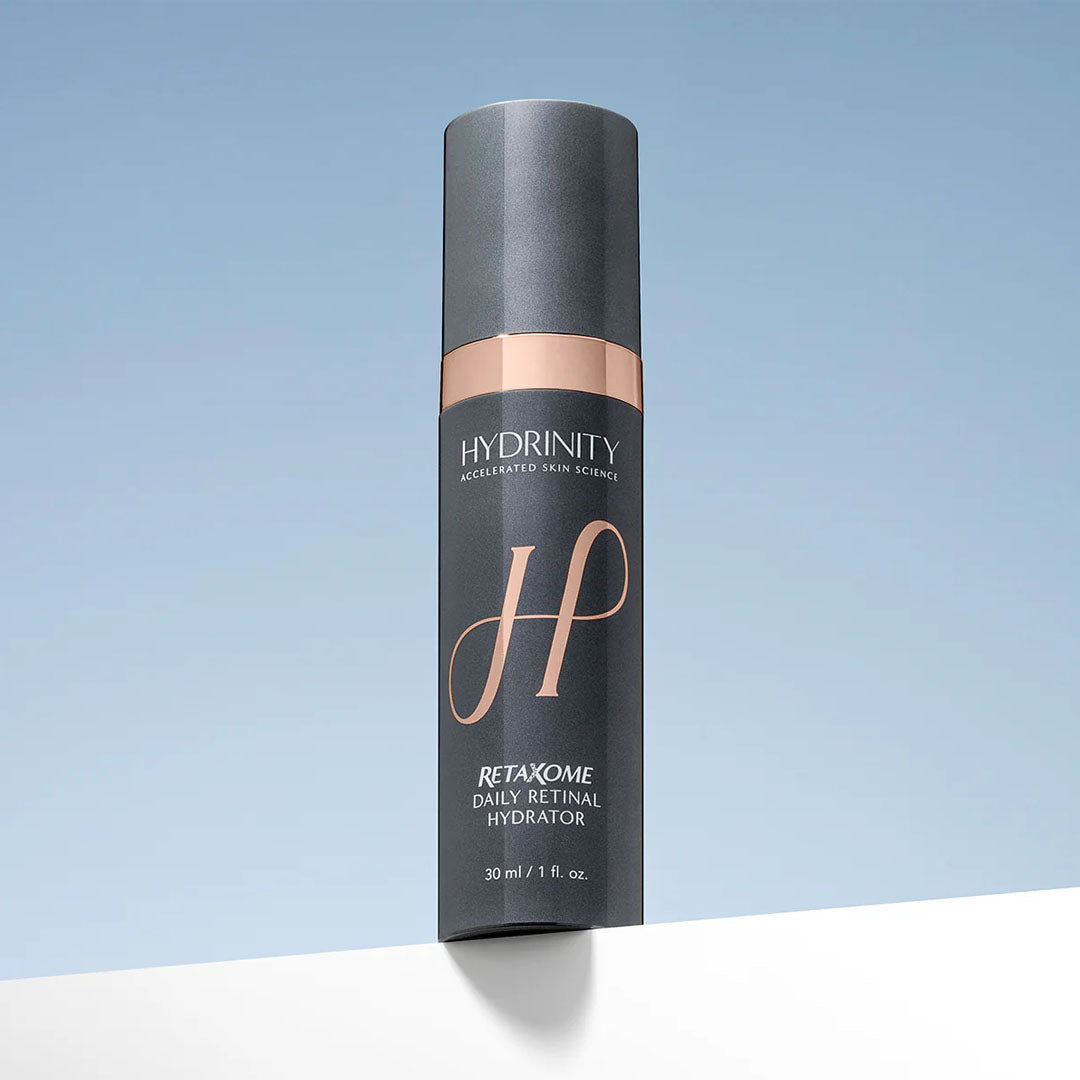 Hydrinity Retaxome Daily Retinal Hydrator, a sleek dark gray 30ml pump bottle with rose gold accents.