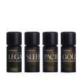 Four dark amber glass Vitruvi essential oil blend bottles with black caps, labeled Legacy, Sleep, Pacific, and Gold.