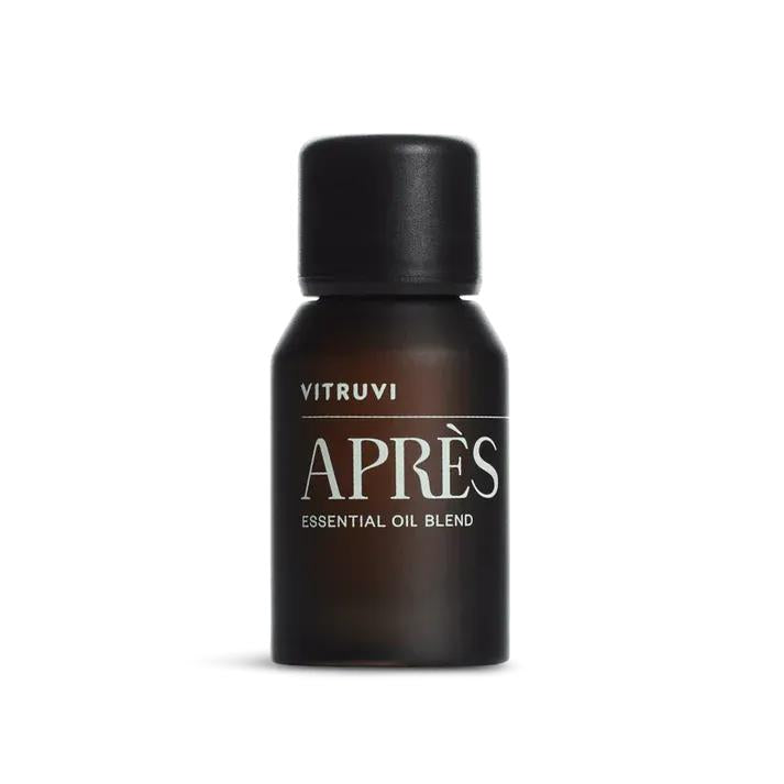 Vitruvi Après Essential Oil Blend in a small, dark brown glass bottle with a black cap.